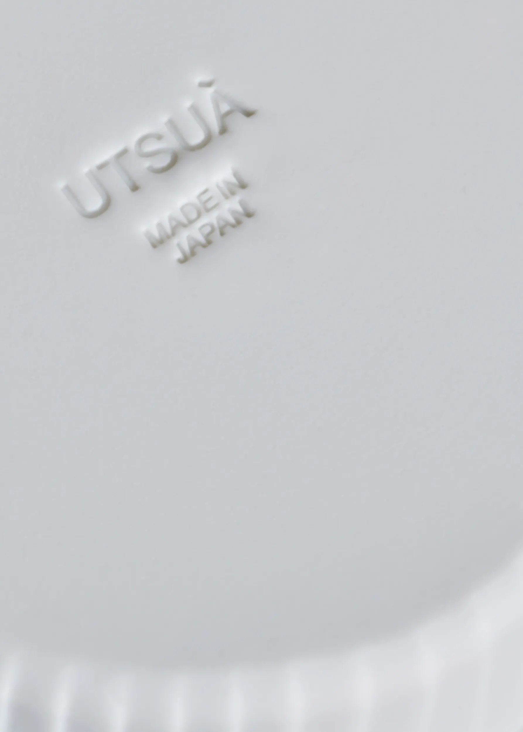UTSUÀ logotype on cup