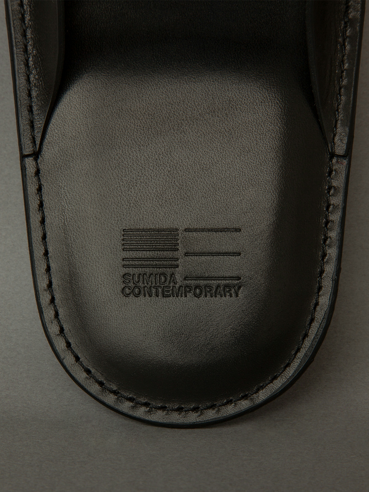 Sumida Contemporary symbol mark embossed in slippers