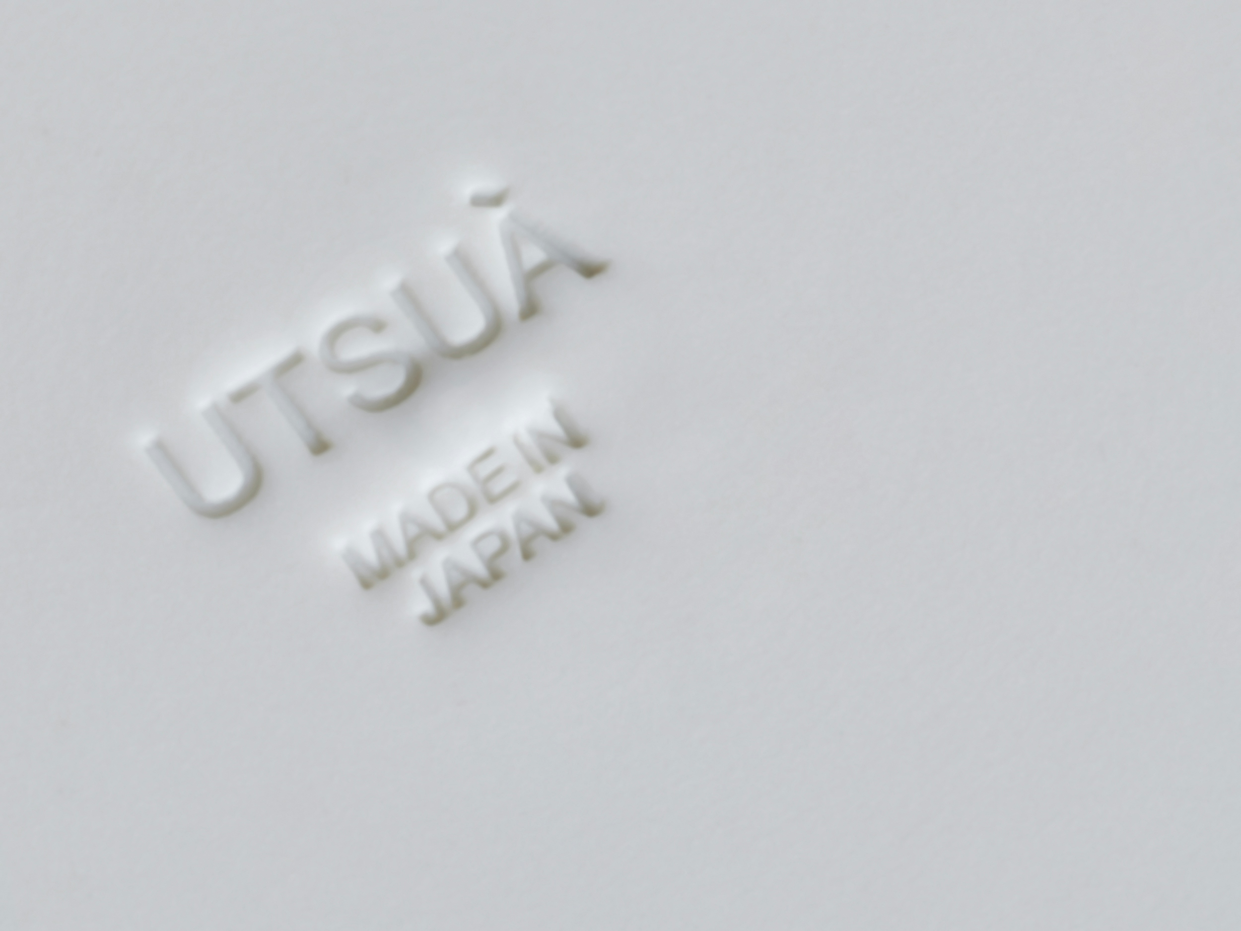 Utsua logo type applied in ceramic cup